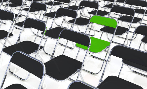 Rows of folding chairs with one chair highlighted in green.